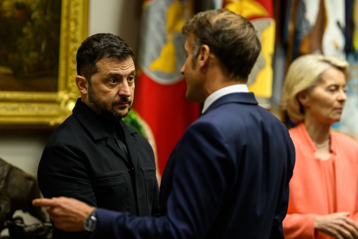 Ukrainian President Volodymyr Zelenskyy speaks with French President Emmanuel Macron while waiting in the Roosevelt Room as President Donald Trump makes a call with Russian President Vladimir Putin in the Oval Office, Monday, August 18, 2025. (Official White House Photo by Daniel Torok)