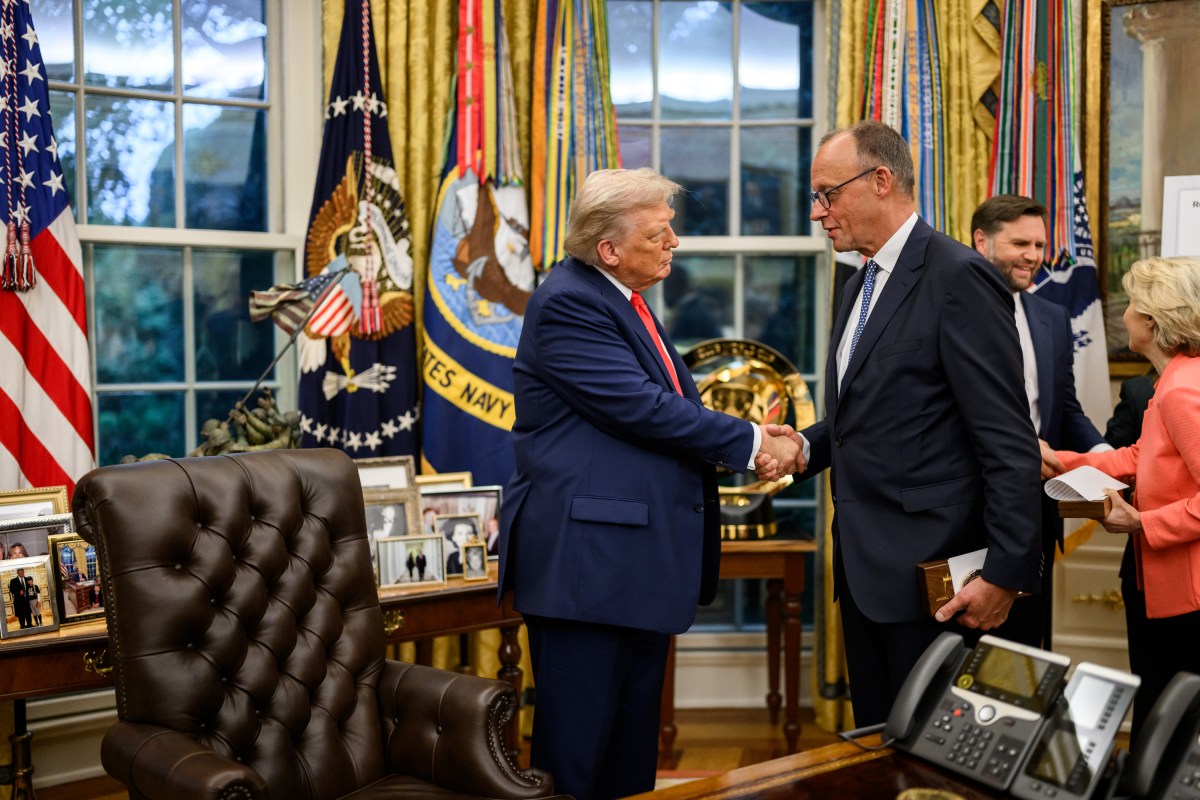 President Donald Trump shakes hands with German Chancellor Friedrich Merz after their meeting, Monday, August 18, 2025, in the Oval Office. (Official White House Photo by Daniel Torok)