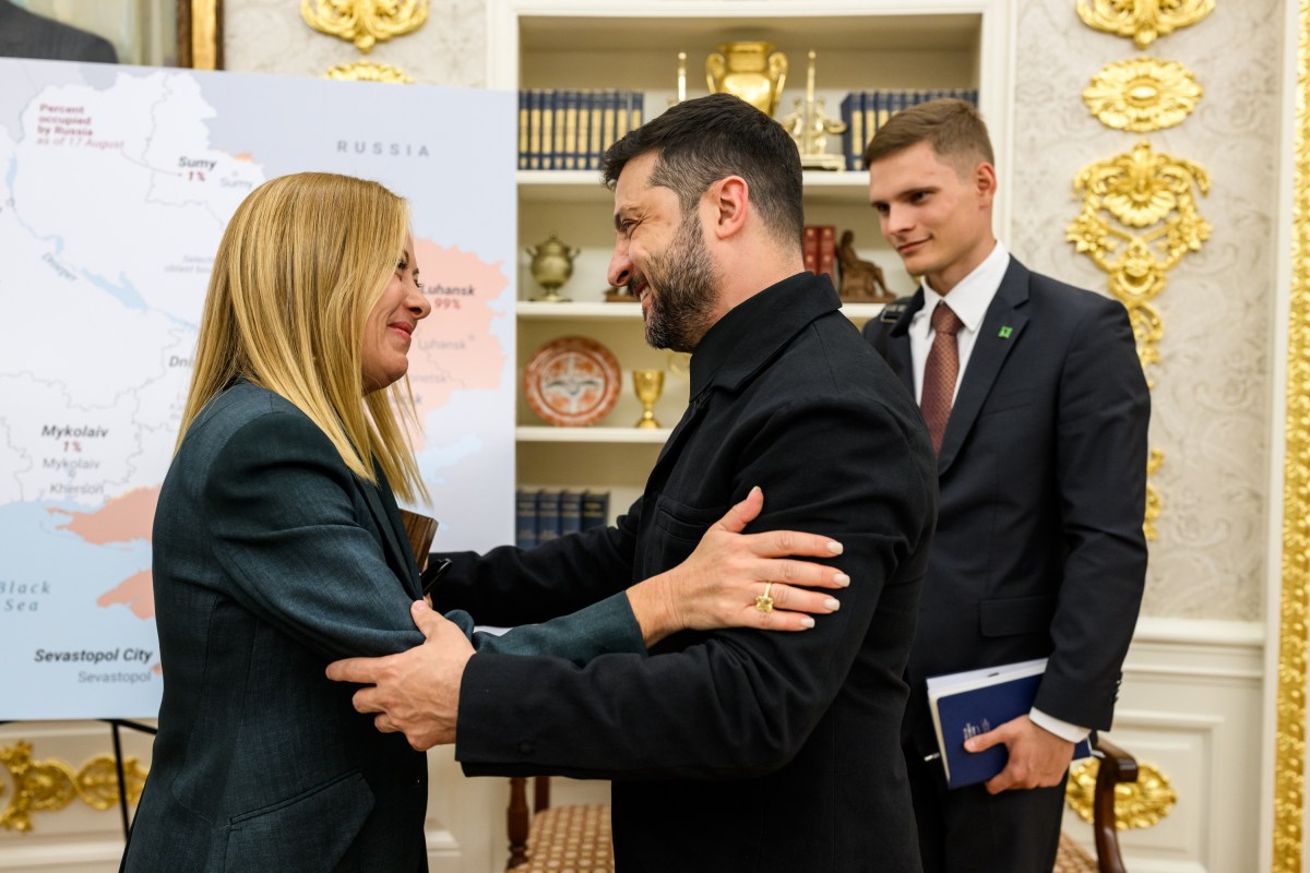 Ukrainian President Volodymyr Zelenskyy hugs Italian Prime Minister Giorgia Meloni after their meeting with President Donald Trump and other European leaders, Monday, August 18, 2025, in the Oval Office. (Official White House Photo by Daniel Torok)