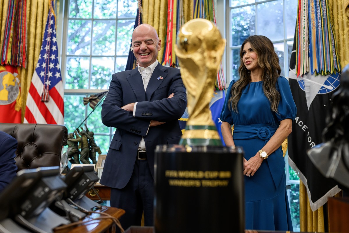 President Donald Trump, flanked by Vice President JD Vance and FIFA President Gianni Infantino, announces that the FIFA World Cup 2025 draw will take place on December 5 at the Kennedy Center, Friday, August 22, 2025 (Official White House Photo by Daniel Torok)