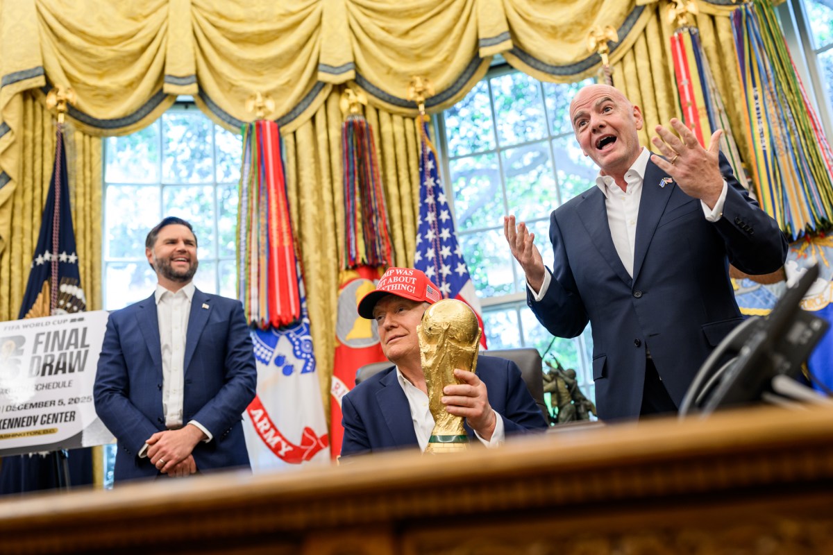 President Donald Trump, flanked by Vice President JD Vance and FIFA President Gianni Infantino, announces that the FIFA World Cup 2025 draw will take place on December 5 at the Kennedy Center, Friday, August 22, 2025 (Official White House Photo by Daniel Torok)