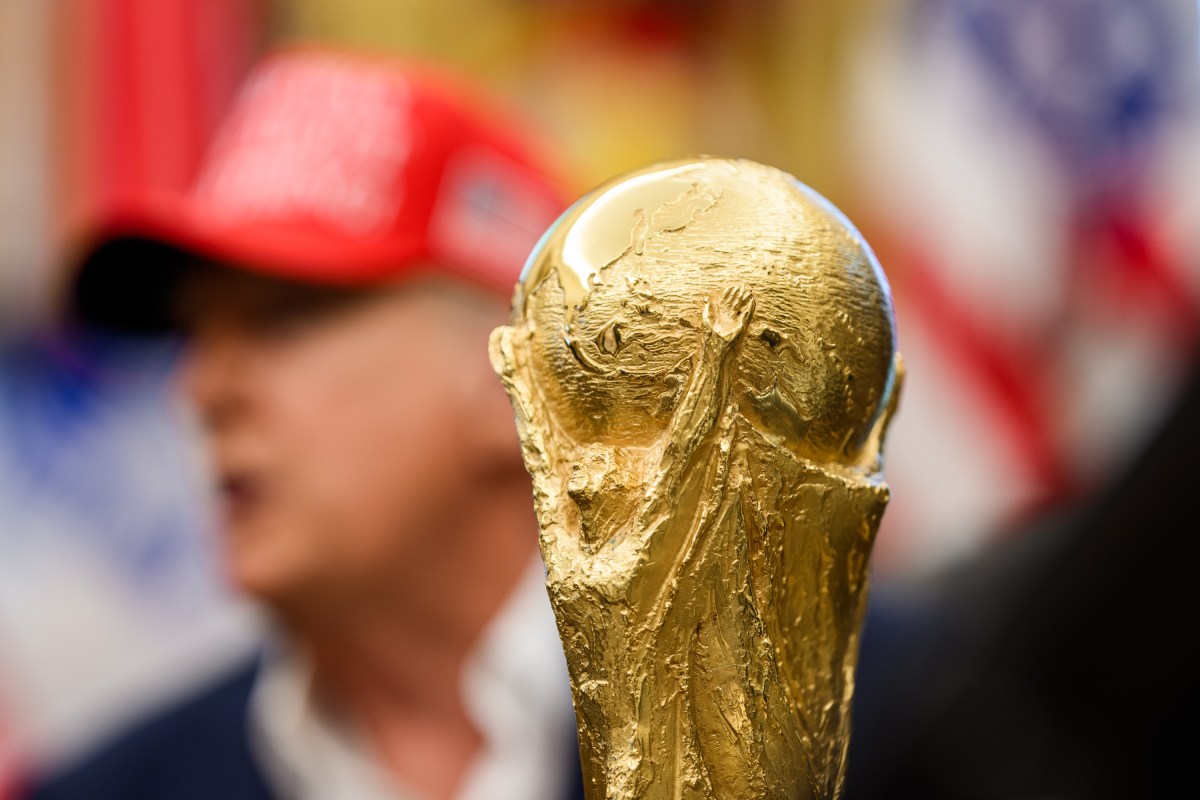 President Donald Trump, flanked by Vice President JD Vance and FIFA President Gianni Infantino, announces that the FIFA World Cup 2025 draw will take place on December 5 at the Kennedy Center, Friday, August 22, 2025 (Official White House Photo by Daniel Torok)