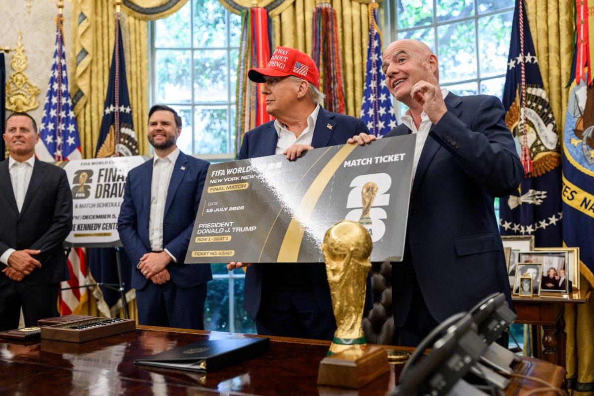 President Donald Trump, flanked by Vice President JD Vance and FIFA President Gianni Infantino, announces that the FIFA World Cup 2025 draw will take place on December 5 at the Kennedy Center, Friday, August 22, 2025 (Official White House Photo by Daniel Torok)