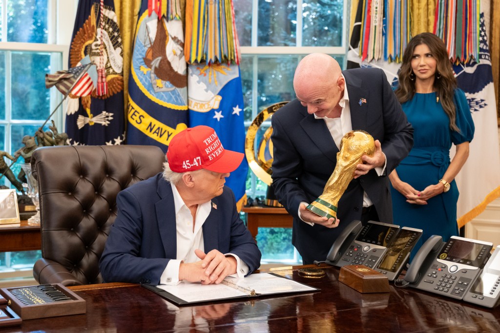 President Donald Trump, flanked by Vice President JD Vance and FIFA President Gianni Infantino, announces that the FIFA World Cup draw will take place on December 5 at the Kennedy Center, Friday, August 22, 2025. (Official White House Photo by Joyce N. Boghosian)