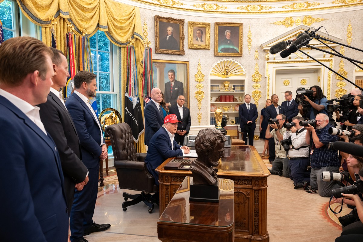 President Donald Trump, flanked by Vice President JD Vance and FIFA President Gianni Infantino, announces that the FIFA World Cup draw will take place on December 5 at the Kennedy Center, Friday, August 22, 2025. (Official White House Photo by Joyce N. Boghosian)