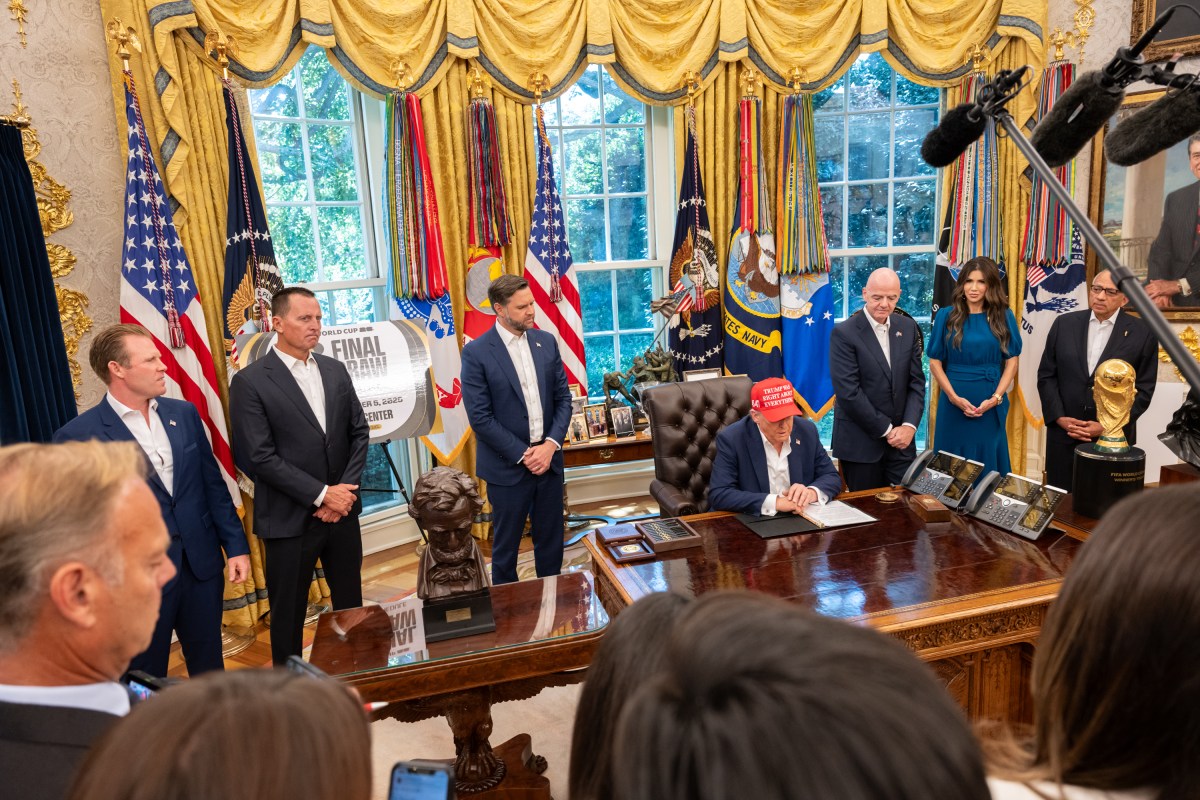 President Donald Trump, flanked by Vice President JD Vance and FIFA President Gianni Infantino, announces that the FIFA World Cup draw will take place on December 5 at the Kennedy Center, Friday, August 22, 2025. (Official White House Photo by Joyce N. Boghosian)