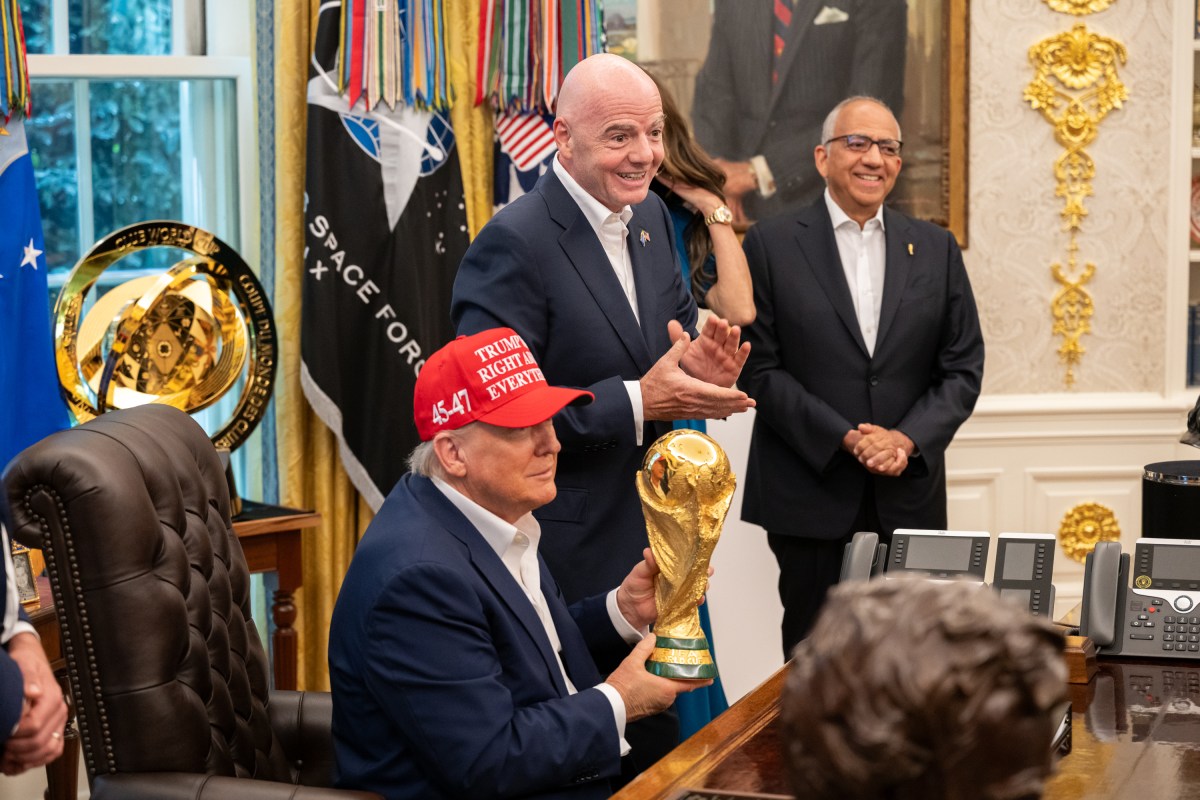 FIFA President Gianni Infantino shows President Donald Trump the FIFA World Cup Trophy during an announcement in the Oval Office, Friday, August 22, 2025. (Official White House Photo by Joyce N. Boghosian)