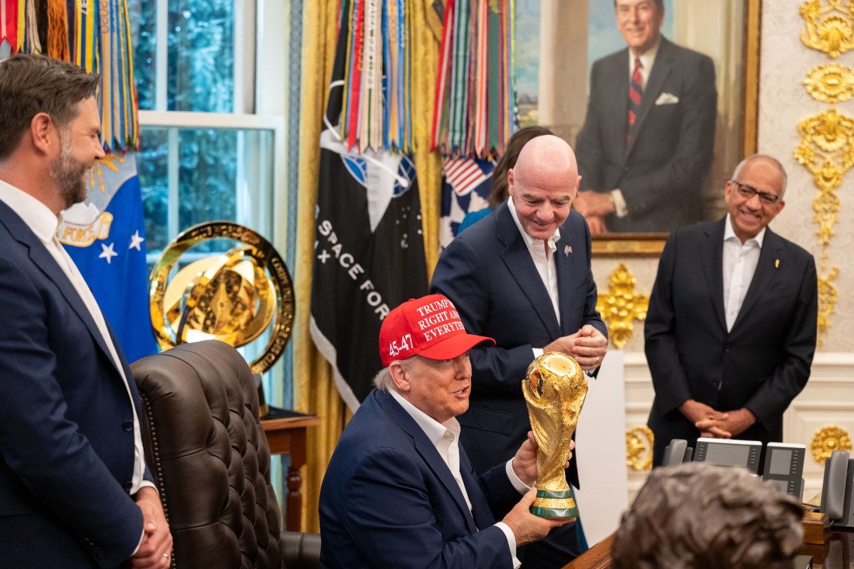 FIFA President Gianni Infantino shows President Donald Trump the FIFA World Cup Trophy during an announcement in the Oval Office, Friday, August 22, 2025. (Official White House Photo by Joyce N. Boghosian)