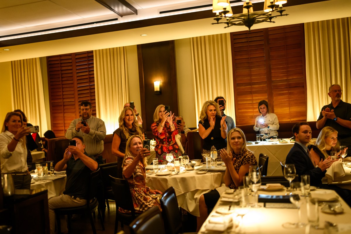 People take photos of President Donald Trump inside Joe's Seafood, Prime Steak & Stone Crab restaurant in Washington, D.C., Tuesday, September 9, 2025. (Official White House Photo by Daniel Torok)