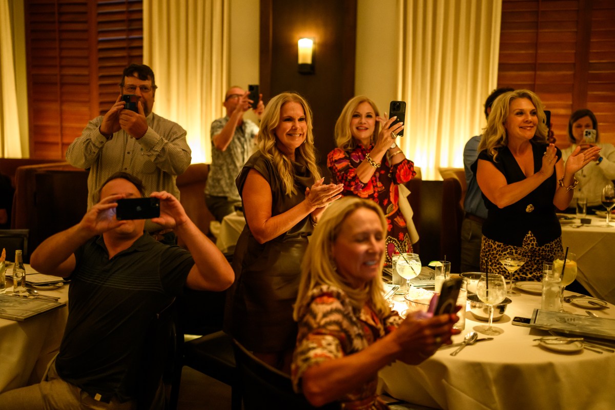 People take photos of President Donald Trump inside Joe's Seafood, Prime Steak & Stone Crab restaurant in Washington, D.C., Tuesday, September 9, 2025. (Official White House Photo by Daniel Torok)