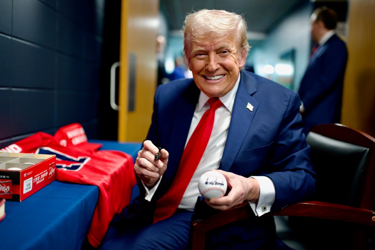 President Donald Trump signs baseballs before attending a game between the New York Yankees and Detroit Tigers on Thursday, September 11, 2025, at Yankee Stadium in the Bronx, New York. (Official White House Photo by Daniel Torok)