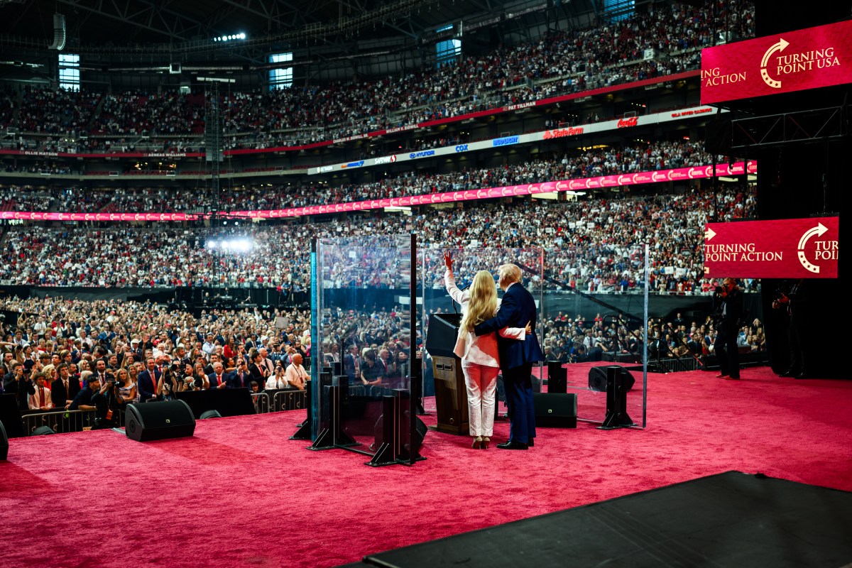 President Donald Trump takes the stage with Erika Kirk at the Memorial Service for Charlie Kirk at State Farm Stadium in Glendale, Arizona, Sunday, September 21, 2025. (Official White House Photo by Daniel Torok)