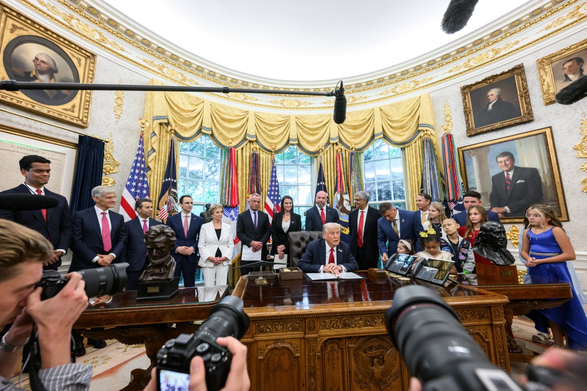 President Donald Trump, joined by HHS Secretary Robert F. Kennedy, Jr. and children affected by cancer and their families, signs an Executive Order to accelerate pediatric cancer research, Tuesday, September 30, 2025, in the Oval Office. (Official White House Photo by Molly Riley)