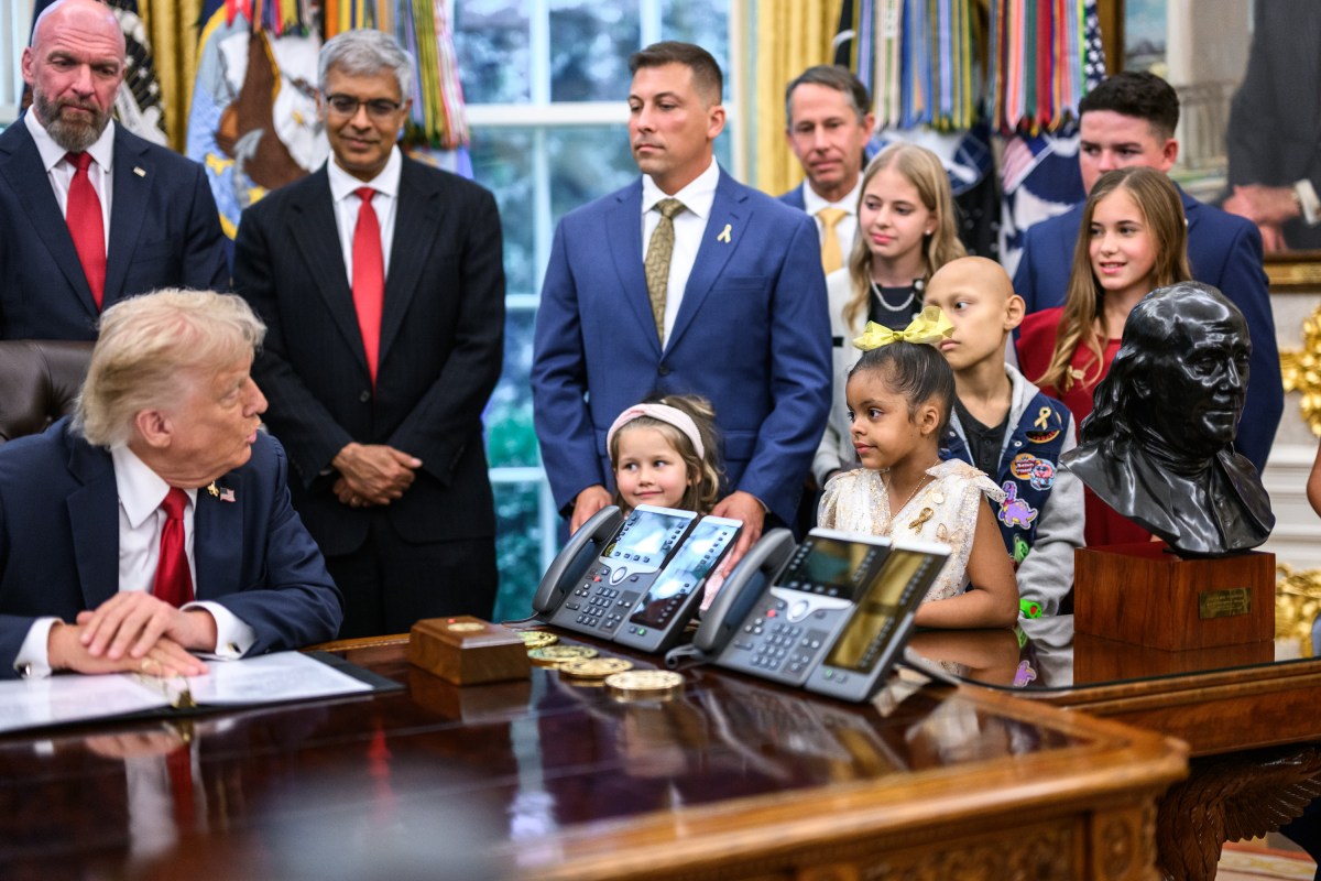 President Donald Trump, joined by HHS Secretary Robert F. Kennedy, Jr. and children affected by cancer and their families, signs an Executive Order to accelerate pediatric cancer research, Tuesday, September 30, 2025, in the Oval Office. (Official White House Photo by Molly Riley)