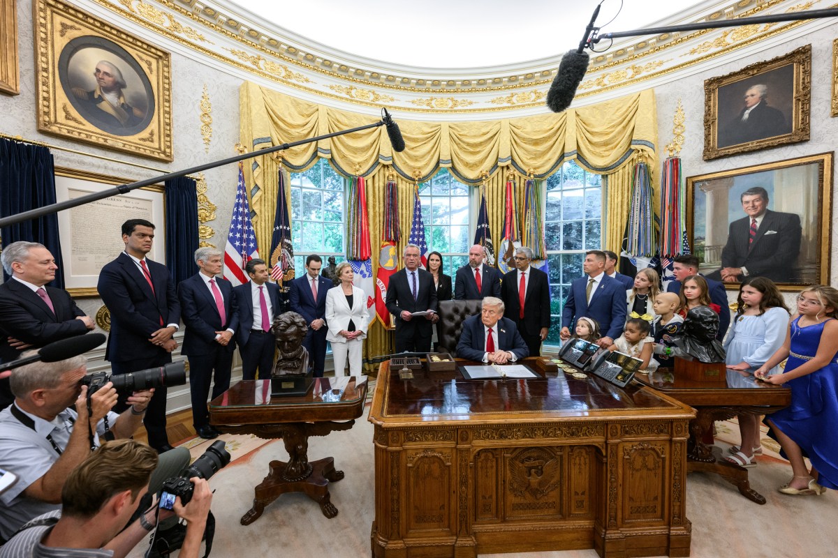 President Donald Trump, joined by HHS Secretary Robert F. Kennedy, Jr. and children affected by cancer and their families, signs an Executive Order to accelerate pediatric cancer research, Tuesday, September 30, 2025, in the Oval Office. (Official White House Photo by Molly Riley)