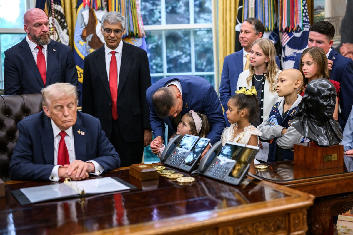 President Donald Trump, joined by HHS Secretary Robert F. Kennedy, Jr. and children affected by cancer and their families, signs an Executive Order to accelerate pediatric cancer research, Tuesday, September 30, 2025, in the Oval Office. (Official White House Photo by Molly Riley)