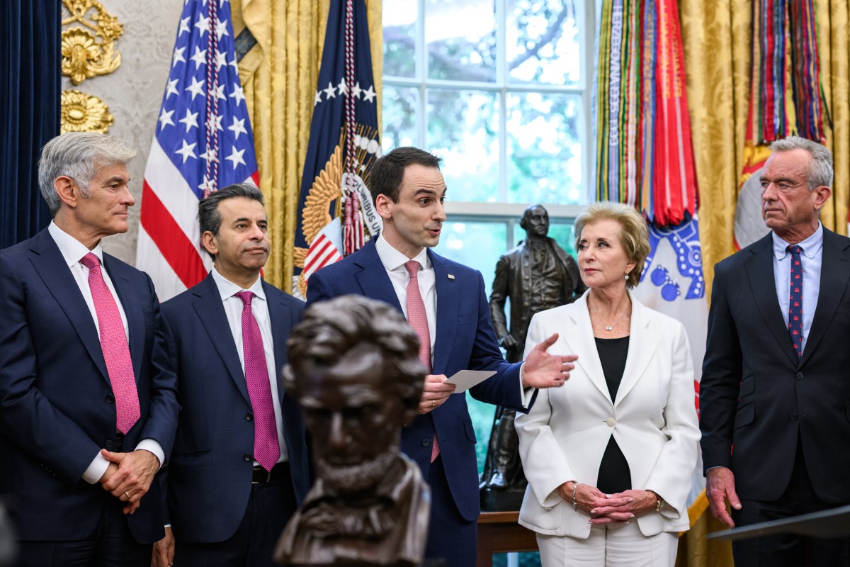 President Donald Trump, joined by HHS Secretary Robert F. Kennedy, Jr. and children affected by cancer and their families, signs an Executive Order to accelerate pediatric cancer research, Tuesday, September 30, 2025, in the Oval Office. (Official White House Photo by Molly Riley)