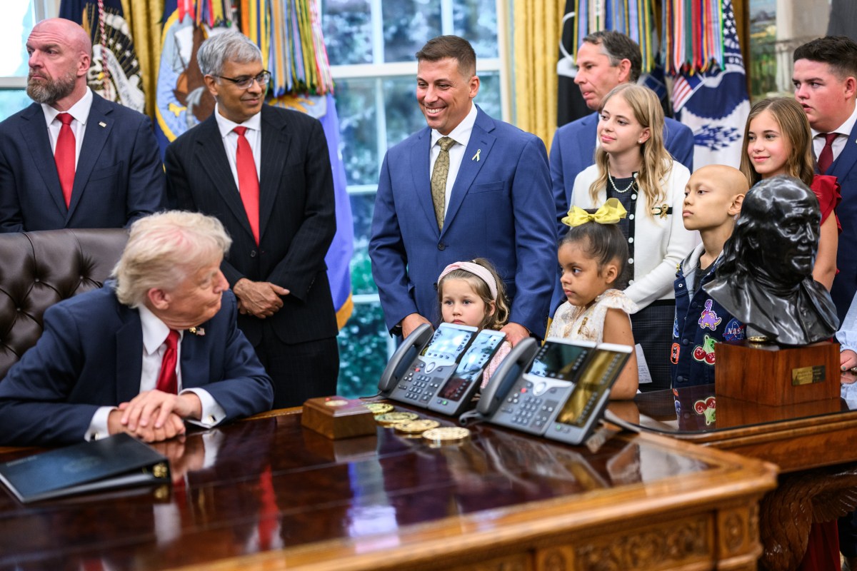 President Donald Trump, joined by HHS Secretary Robert F. Kennedy, Jr. and children affected by cancer and their families, signs an Executive Order to accelerate pediatric cancer research, Tuesday, September 30, 2025, in the Oval Office. (Official White House Photo by Molly Riley)