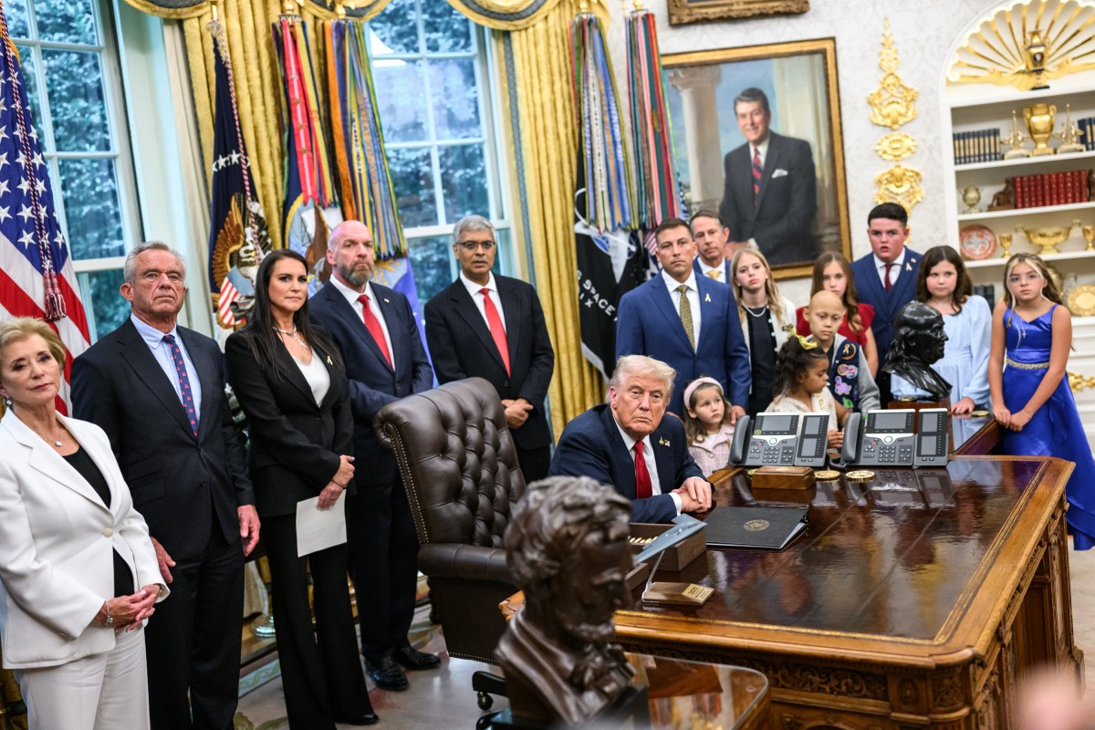 President Donald Trump, joined by HHS Secretary Robert F. Kennedy, Jr. and children affected by cancer and their families, signs an Executive Order to accelerate pediatric cancer research, Tuesday, September 30, 2025, in the Oval Office. (Official White House Photo by Molly Riley)