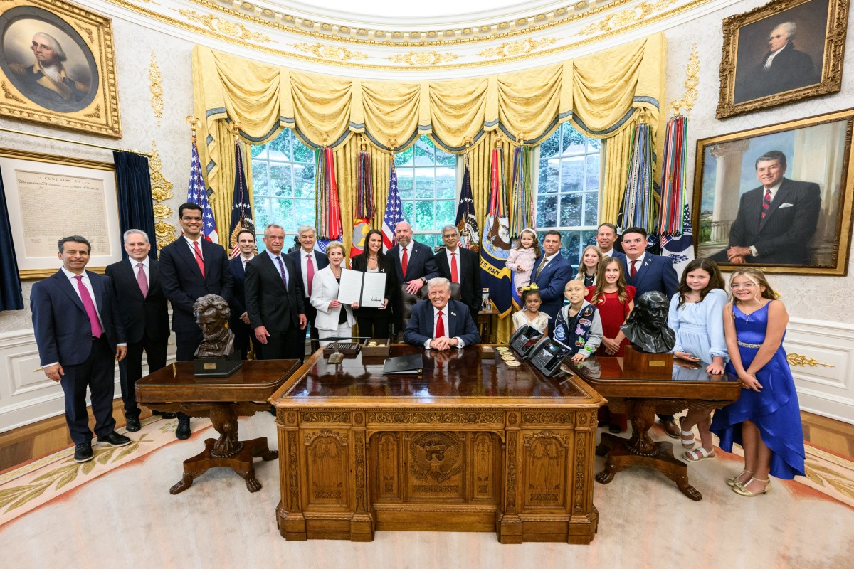 President Donald Trump, joined by HHS Secretary Robert F. Kennedy, Jr. and children affected by cancer and their families, signs an Executive Order to accelerate pediatric cancer research, Tuesday, September 30, 2025, in the Oval Office. (Official White House Photo by Molly Riley)