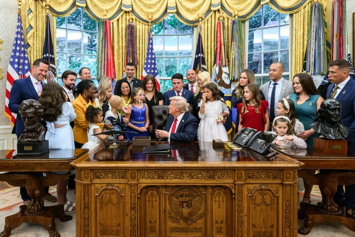 President Donald Trump, joined by HHS Secretary Robert F. Kennedy, Jr. and children affected by cancer and their families, signs an Executive Order to accelerate pediatric cancer research, Tuesday, September 30, 2025, in the Oval Office. (Official White House Photo by Molly Riley)