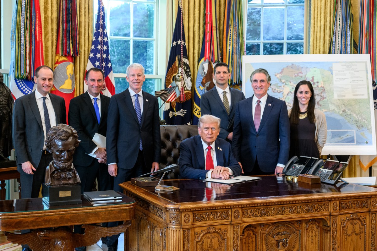 President Donald Trump, flanked by Secretary of Energy Chris Wright and Secretary of the Interior Doug Burgum, signs an Executive Order approving the Ambler Road Project in Alaska, Monday, October 6, 2025, in the Oval Office. (Official White House Photo by Joyce N. Boghosian)
