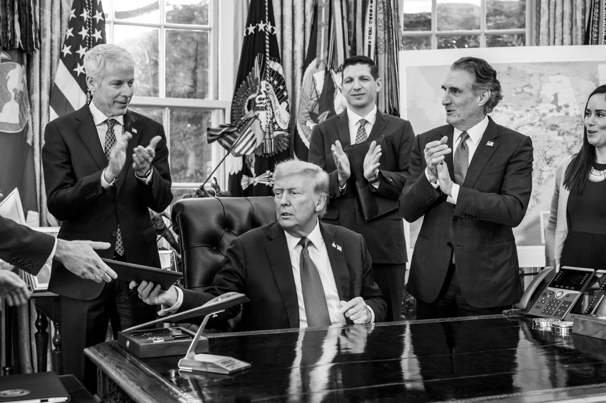 President Donald Trump, flanked by Secretary of Energy Chris Wright and Secretary of the Interior Doug Burgum, signs an Executive Order approving the Ambler Road Project in Alaska, Monday, October 6, 2025, in the Oval Office. (Official White House Photo by Joyce N. Boghosian)
