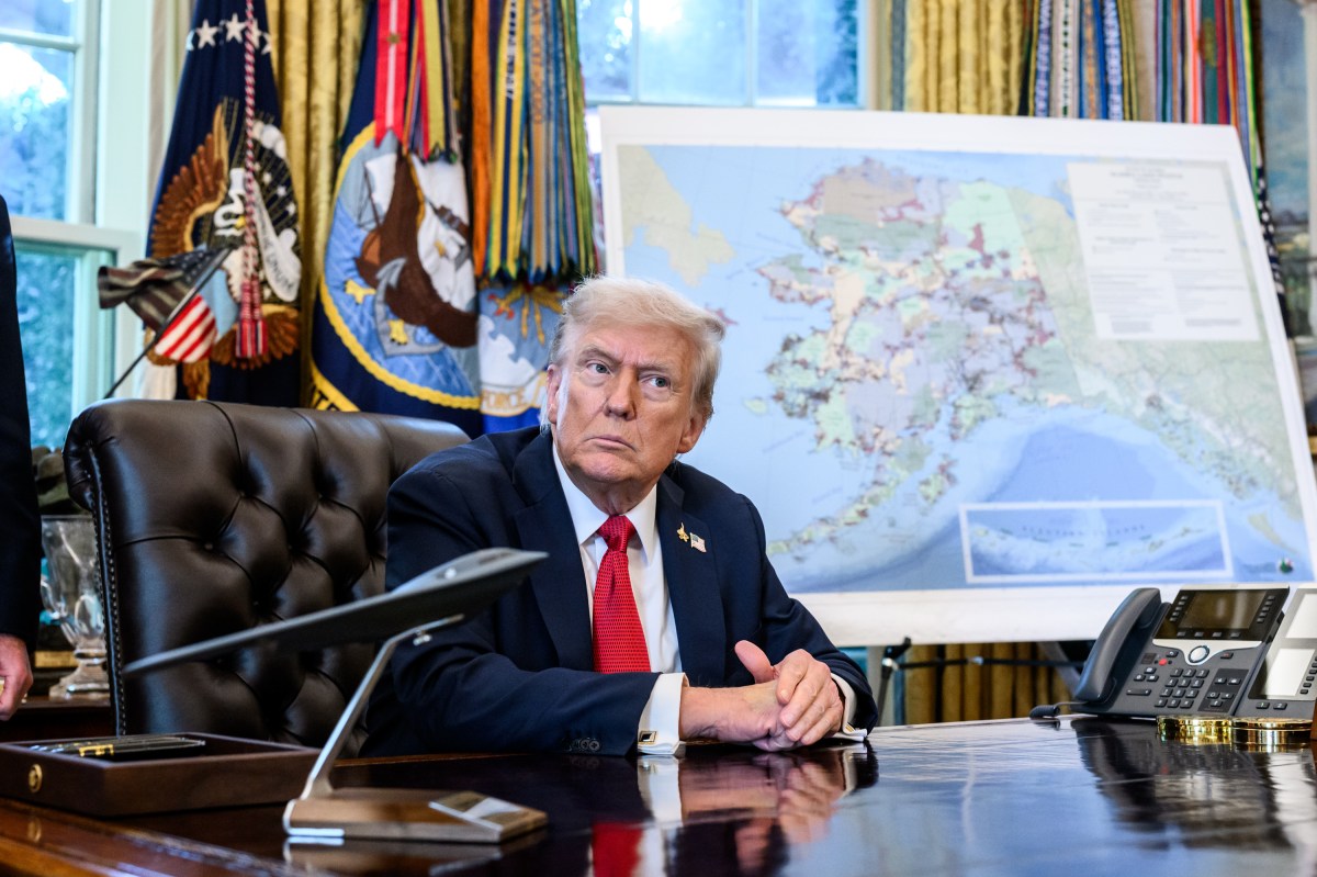 President Donald Trump, flanked by Secretary of Energy Chris Wright and Secretary of the Interior Doug Burgum, signs an Executive Order approving the Ambler Road Project in Alaska, Monday, October 6, 2025, in the Oval Office. (Official White House Photo by Joyce N. Boghosian)