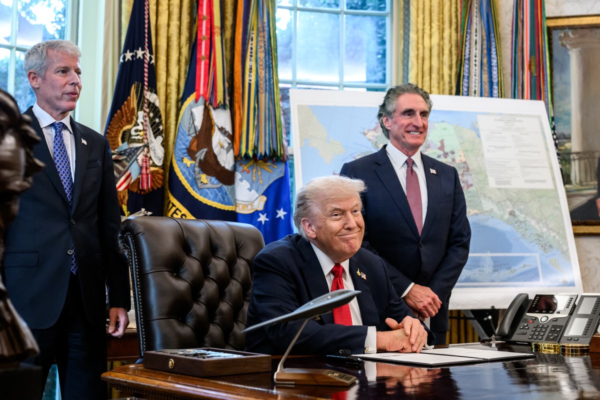 President Donald Trump, flanked by Secretary of Energy Chris Wright and Secretary of the Interior Doug Burgum, signs an Executive Order approving the Ambler Road Project in Alaska, Monday, October 6, 2025, in the Oval Office. (Official White House Photo by Joyce N. Boghosian)