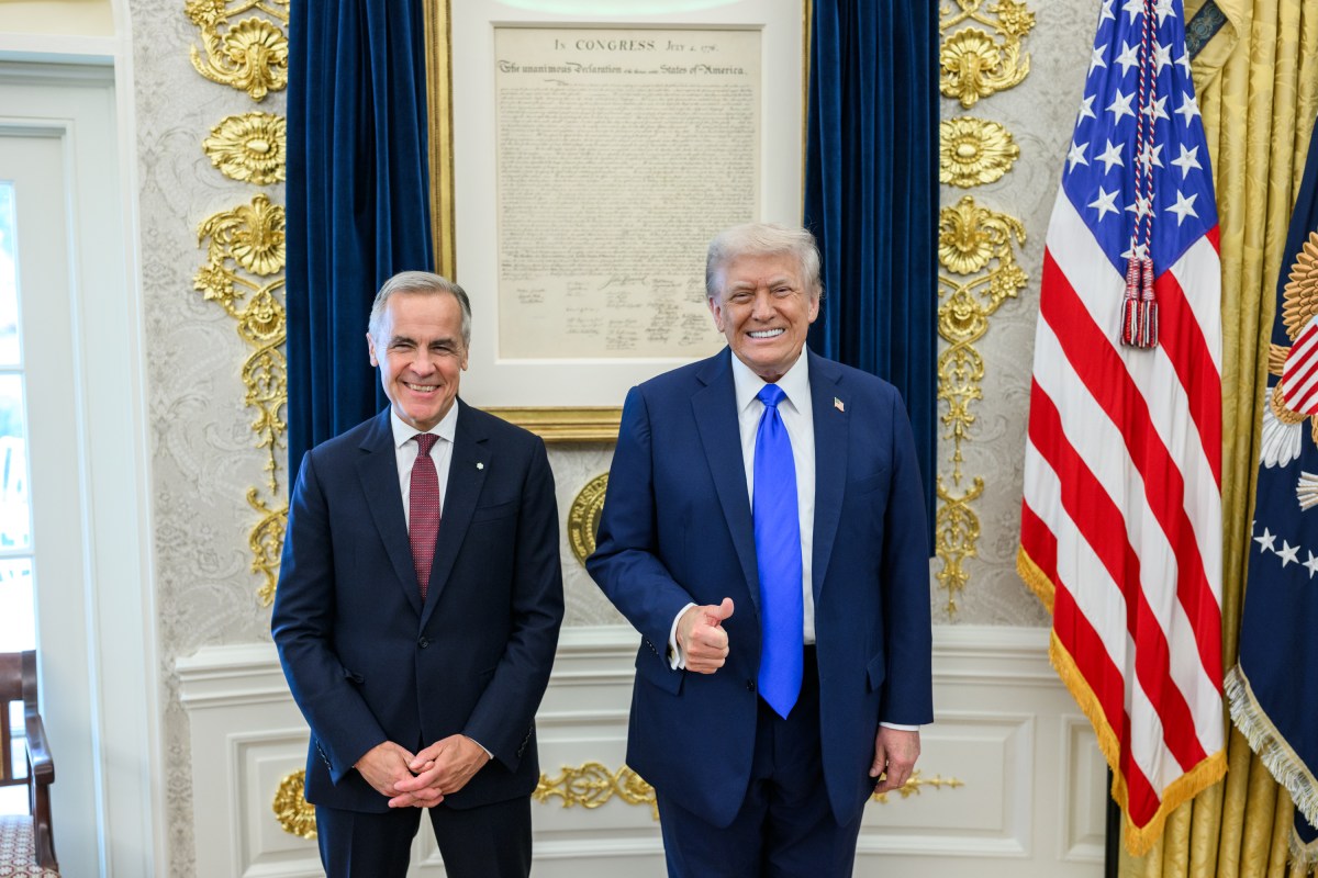 President Donald Trump poses for photos with Canadian Prime Minister Mark Carney before their meeting in the Oval Office, Tuesday, October 7, 2025. (Official White House Photo by Daniel Torok)