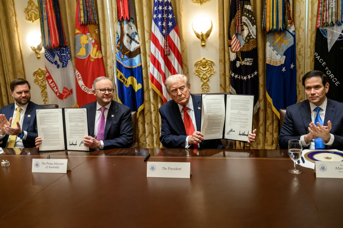 President Donald Trump and Australian Prime Minister Anthony Albanese show members of the media a signed agreement on critical minerals after a bilateral meeting in the Cabinet Room, Monday, October 20, 2025. (Official White House Photo by Daniel Torok)