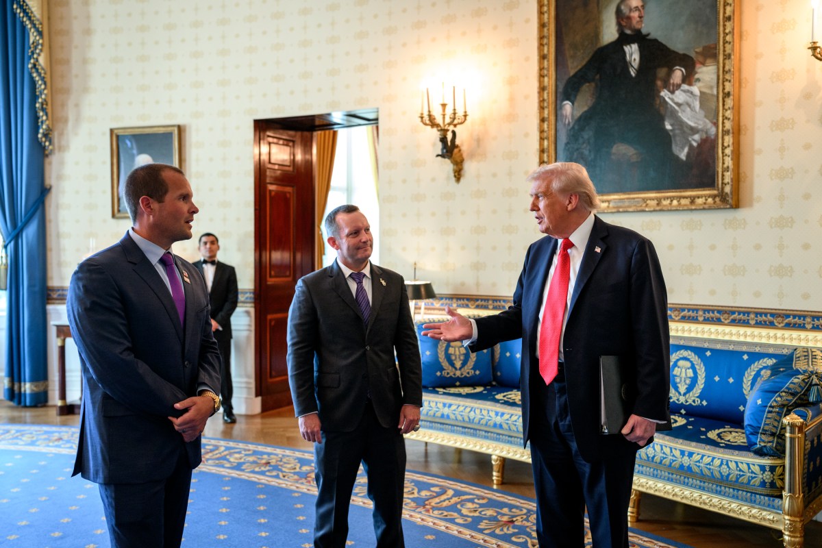 President Donald Trump greets Louisiana State University Tigers head coach Jay Johnson and LSU Shreveport Pilots head coach Brad Neffendorf in the Blue Room before a 2025 College World Series Championship event at the White House, Monday, October 20, 2025 (Official White House Photo by Molly Riley)