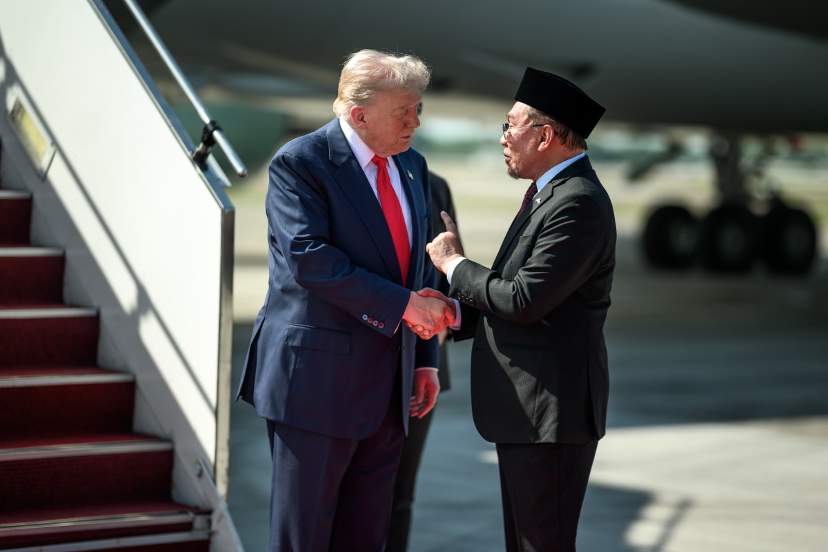 President Donald Trump is greeted by Malaysian Prime Minister Anwar Ibrahim after his arrival at Kuala Lumpur International Airport in Kuala Lumpur, Malaysia, Sunday, October 25, 2025. (Official White House Photo by Daniel Torok)