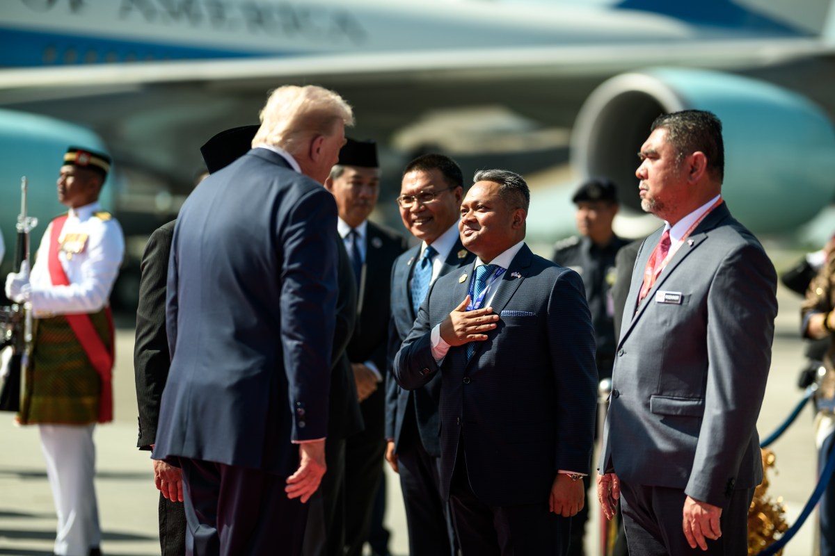 President Donald Trump is greeted by Malaysian Prime Minister Anwar Ibrahim and others during an arrival ceremony at Kuala Lumpur International Airport in Kuala Lumpur, Malaysia, Sunday, October 25, 2025. (Official White House Photo by Daniel Torok)
