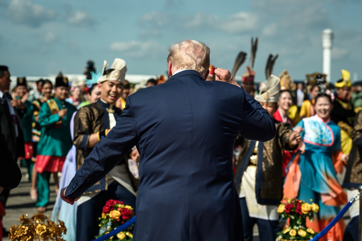 President Donald Trump dances with Malaysian performers during an arrival ceremony at Kuala Lumpur International Airport in Kuala Lumpur, Malaysia, Sunday, October 25, 2025. (Official White House Photo by Daniel Torok)