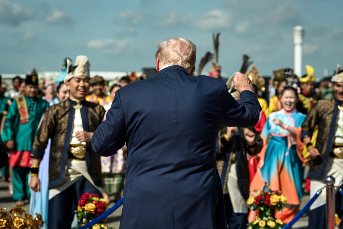 President Donald Trump dances with Malaysian performers during an arrival ceremony at Kuala Lumpur International Airport in Kuala Lumpur, Malaysia, Sunday, October 25, 2025. (Official White House Photo by Daniel Torok)