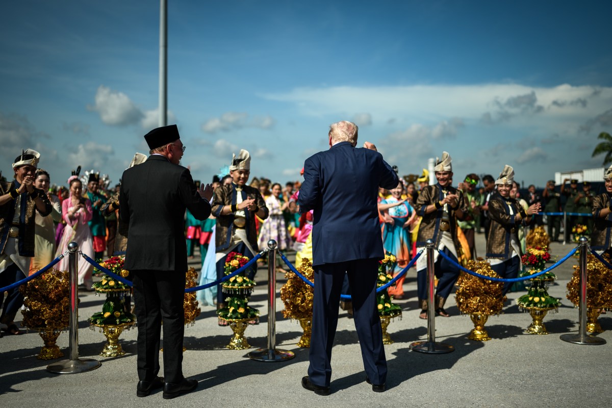 President Donald Trump dances with Malaysian performers during an arrival ceremony at Kuala Lumpur International Airport in Kuala Lumpur, Malaysia, Sunday, October 25, 2025. (Official White House Photo by Daniel Torok)
