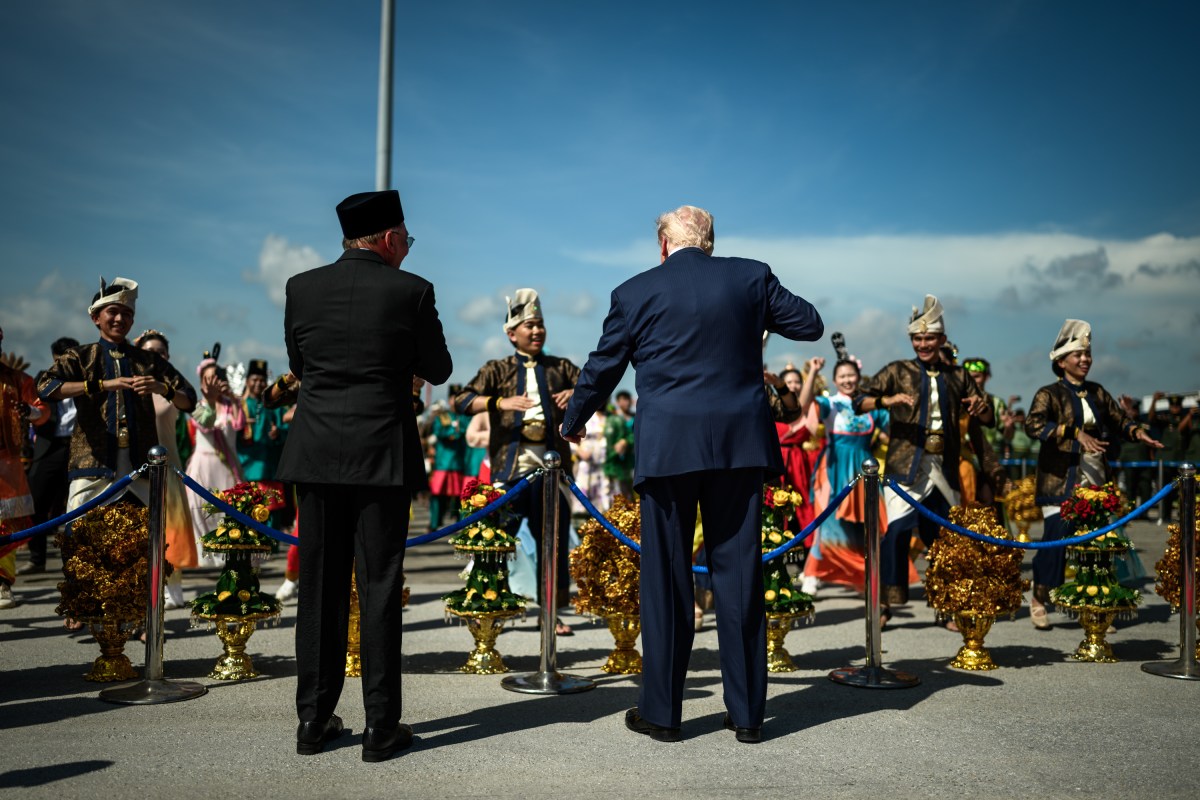 President Donald Trump dances with Malaysian performers during an arrival ceremony at Kuala Lumpur International Airport in Kuala Lumpur, Malaysia, Sunday, October 25, 2025. (Official White House Photo by Daniel Torok)