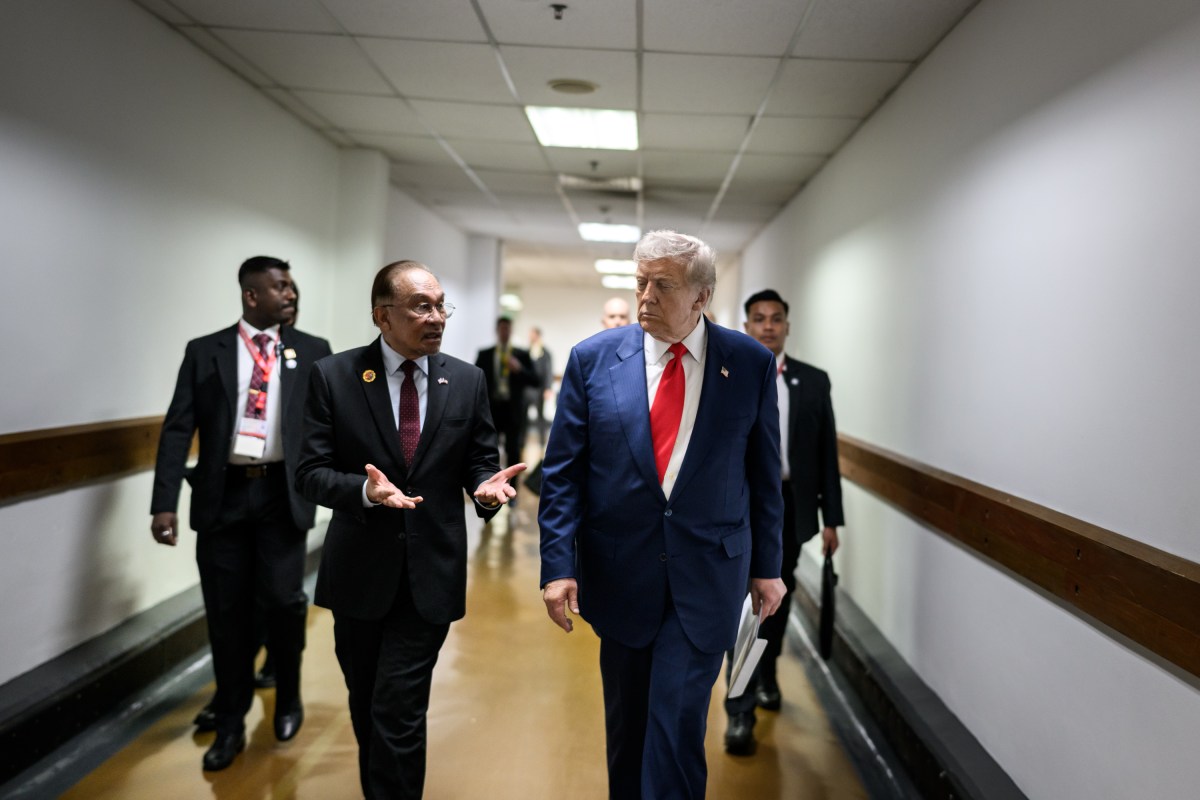 President Donald Trump speaks with Malaysian Prime Minister Seri Anwar Ibrahim after signing the Kuala Lumpur Accord, Sunday, October 25, 2025, at the ASEAN Summit in Kuala Lumpur, Malaysia. (Official White House Photo by Daniel Torok)