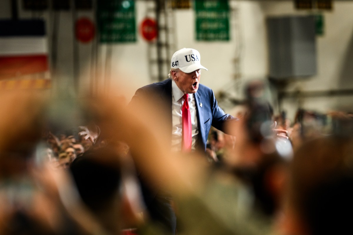 President Donald Trump leaves the stage after delivering remarks to Yokosuka Naval troops aboard the USS George Washington at Yokosuka Naval Base, Japan on Tuesday, October 28, 2025.  (Official White House Photo by Daniel Torok)