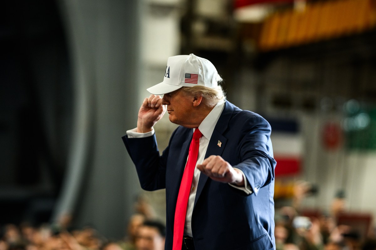 President Donald Trump leaves the stage after delivering remarks to Yokosuka Naval troops aboard the USS George Washington at Yokosuka Naval Base, Japan on Tuesday, October 28, 2025.  (Official White House Photo by Daniel Torok)