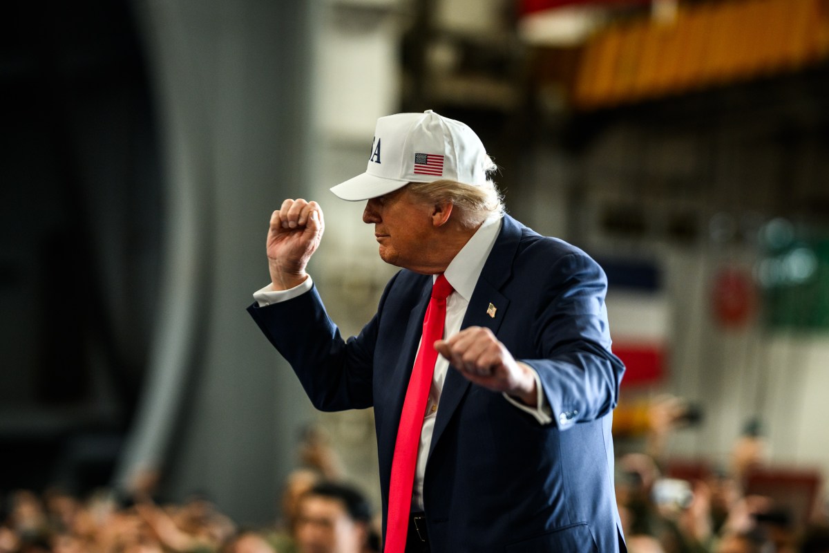 President Donald Trump leaves the stage after delivering remarks to Yokosuka Naval troops aboard the USS George Washington at Yokosuka Naval Base, Japan on Tuesday, October 28, 2025.  (Official White House Photo by Daniel Torok)