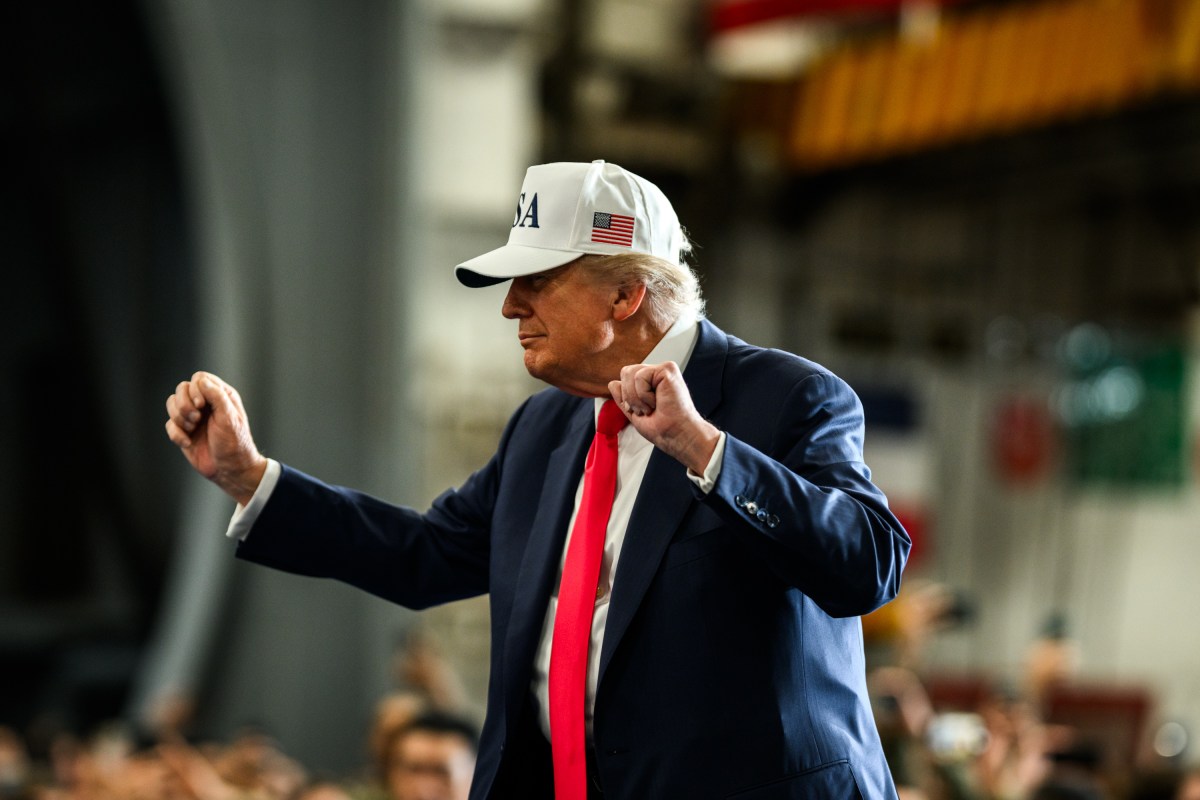 President Donald Trump leaves the stage after delivering remarks to Yokosuka Naval troops aboard the USS George Washington at Yokosuka Naval Base, Japan on Tuesday, October 28, 2025.  (Official White House Photo by Daniel Torok)