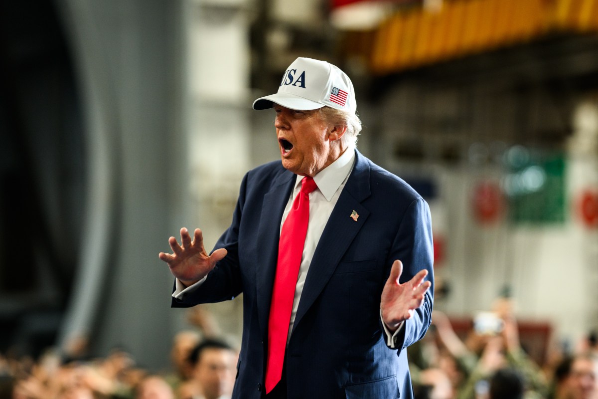 President Donald Trump leaves the stage after delivering remarks to Yokosuka Naval troops aboard the USS George Washington at Yokosuka Naval Base, Japan on Tuesday, October 28, 2025.  (Official White House Photo by Daniel Torok)