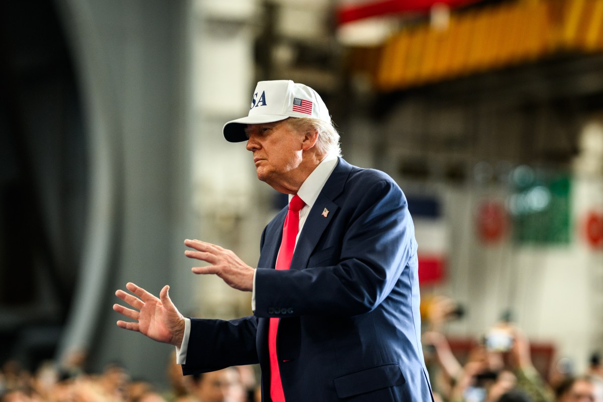 President Donald Trump leaves the stage after delivering remarks to Yokosuka Naval troops aboard the USS George Washington at Yokosuka Naval Base, Japan on Tuesday, October 28, 2025.  (Official White House Photo by Daniel Torok)