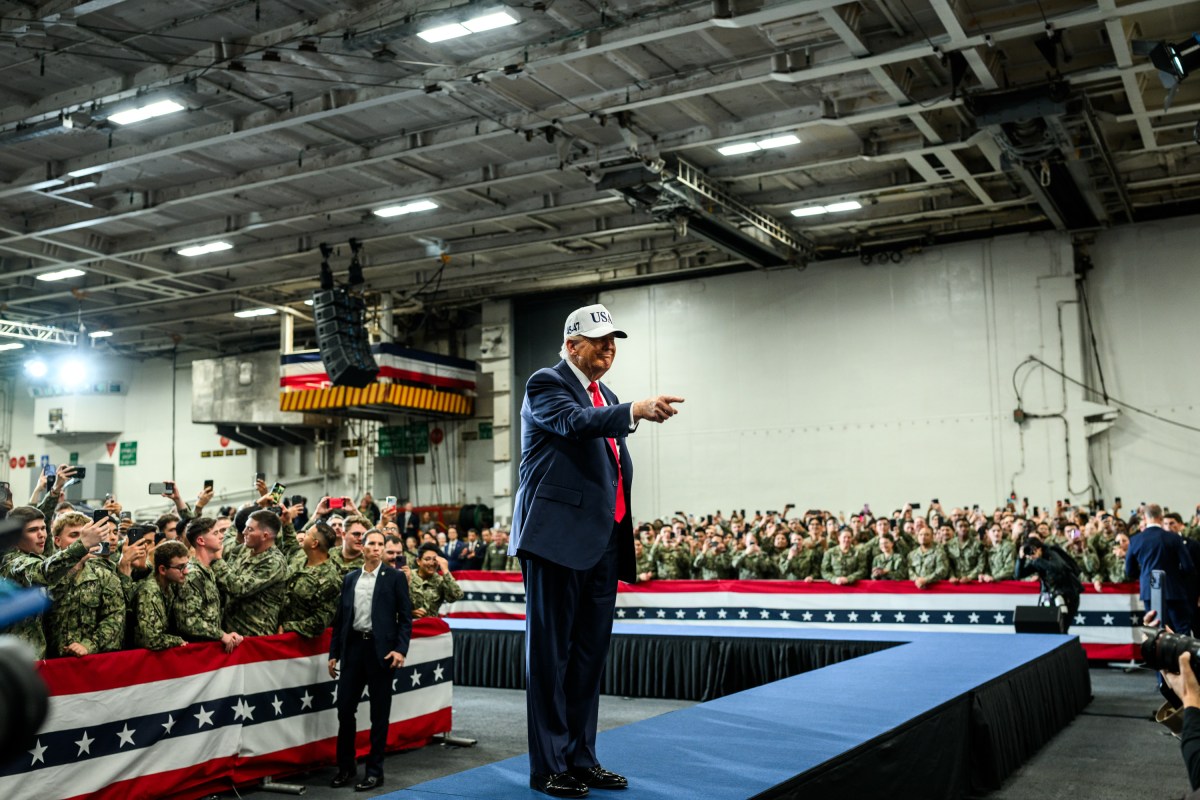 President Donald Trump leaves the stage after delivering remarks to Yokosuka Naval troops aboard the USS George Washington at Yokosuka Naval Base, Japan on Tuesday, October 28, 2025.  (Official White House Photo by Daniel Torok)