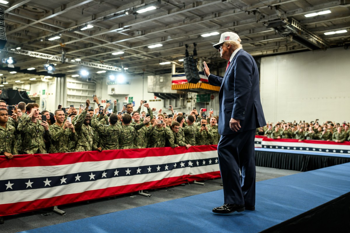 President Donald Trump leaves the stage after delivering remarks to Yokosuka Naval troops aboard the USS George Washington at Yokosuka Naval Base, Japan on Tuesday, October 28, 2025.  (Official White House Photo by Daniel Torok)