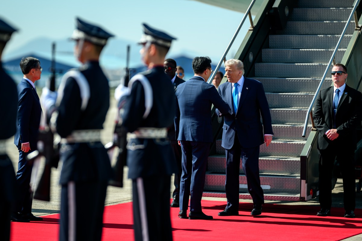 President Donald Trump greets officials after disembarking from Air Force One at Gimhae International Airport in Busan, South Korea on Wednesday, October 29, 2025. (Official White House Photo by Daniel Torok)