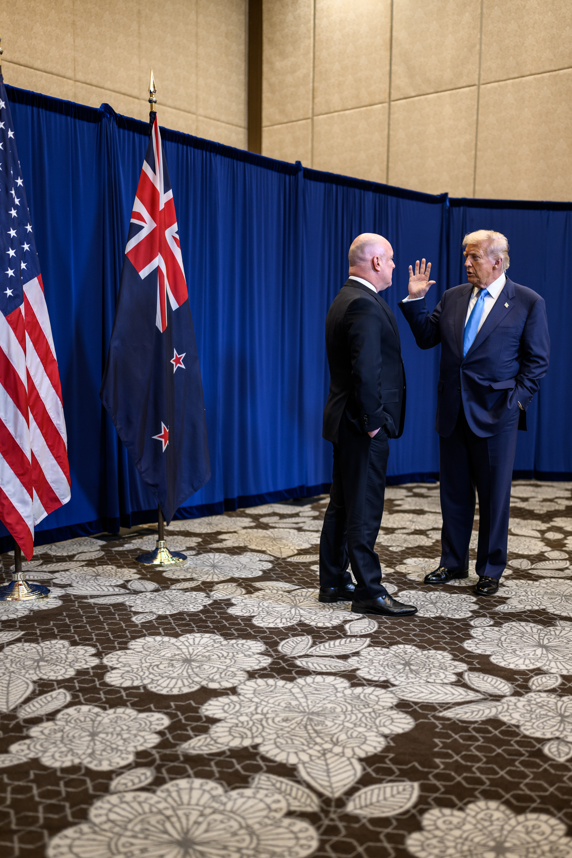 President Donald Trump participates in a pull-aside meeting with