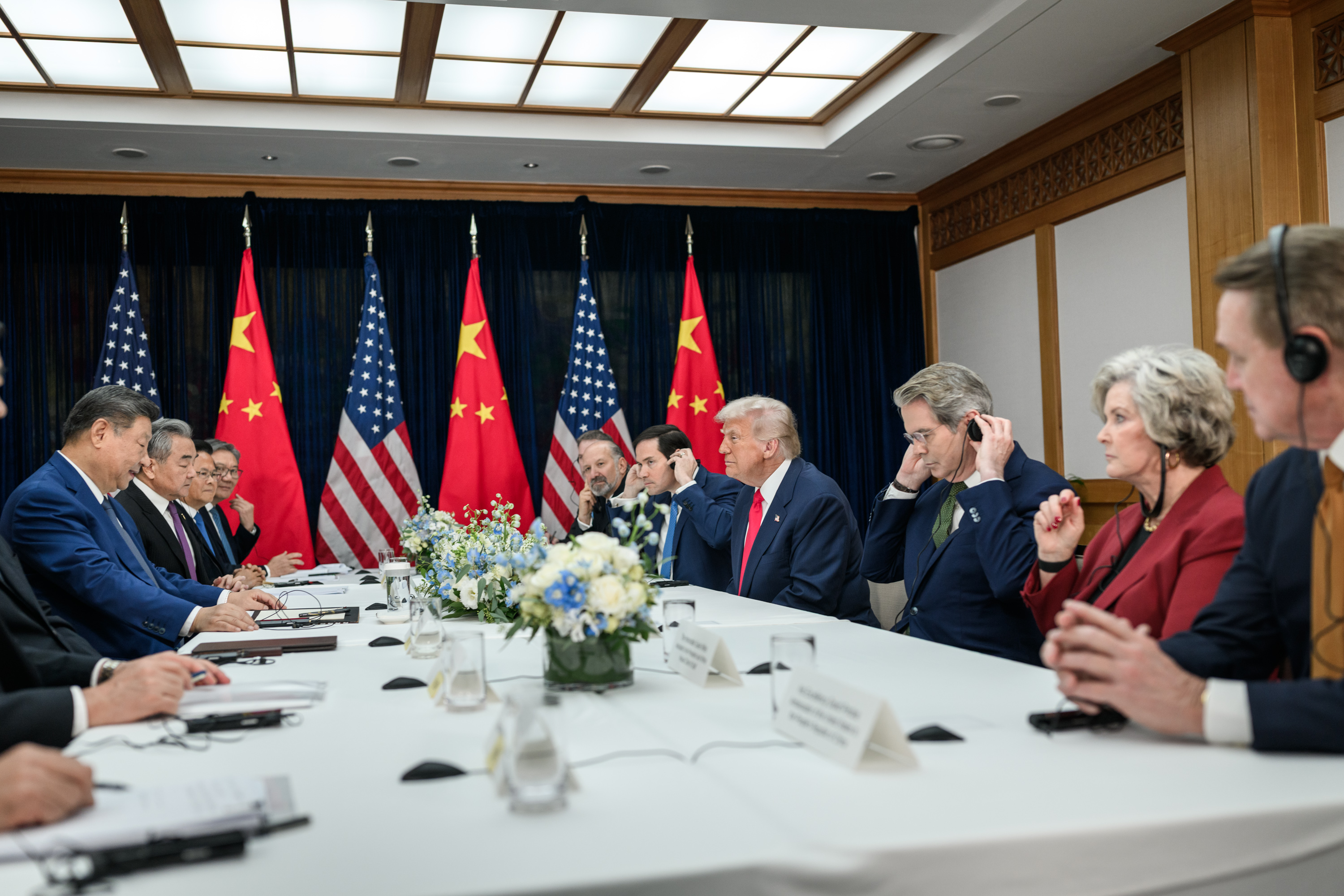 Trump and Xi stand together during the Beijing visit, with U.S. and Chinese flags behind them. Official White House photo (public domain)